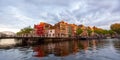 Historic homes at the water front in Leiden city centrum, The city is intersected by numerous small canals with tree-bordered Royalty Free Stock Photo