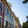 Historic hotel with colorful houses in Charlottetown, Prince Edward Island, Canada