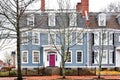 Historic House with Purple Door and Wrought Iron Fence