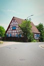 Historic house with blue shutters in Potzbach