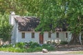 Historic house under old and big oak tree Royalty Free Stock Photo