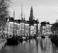 Historic houses and boats in black and white