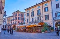 Historic houses and outdoor restaurants on Piazza Giuseppe Malvezzi, Desenzano del Garda, Italy
