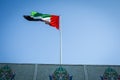 Historic Islamic floral design with UAE national flag in Abu Dhabi, Capital of United Arab Emirates