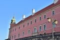 Historic lanterns against the background of the Royal Castle in Warsaw in the light of the rising sun