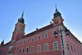 Historic lanterns against the background of the Royal Castle in Warsaw in the light of the rising sun