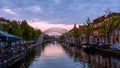 Historic Leiden city centrum under twilight, The city is intersected by numerous small canals with tree-bordered quays Royalty Free Stock Photo