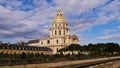 Historic Les Invalides cathedral in Paris, France, grave of Napoleon I., with the golden colored cupola on a sunny day. Royalty Free Stock Photo