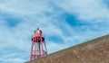 Historic lighthouse on a masonry wall of bricks Royalty Free Stock Photo