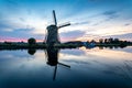 The historic Lisserpoel windmill in the evening. On the Ringvaart river in Lisse.