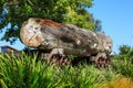 Historic logging industry. A huge log on a rail trolley, displayed in a park