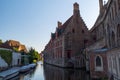 Historic medieval buildings with beautiful canal in the old town of Bruges Brugge