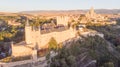 Historic medieval Castle in Segovia, Spain. Drone aerial view with sunset light of spanish stronghold in old town with monument Royalty Free Stock Photo