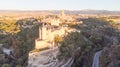 Historic medieval Castle in Segovia, Spain. Drone aerial view with sunset light of spanish stronghold in old town with monument Royalty Free Stock Photo