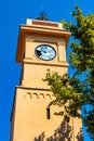 Historic medieval clock tower at Place du 24 Aout square in old town quarter of perfumery city of Grasse in France