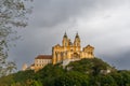 The historic Melk Abbey and church spires on the rocky promontory above the Danube River