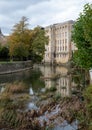 Historic mill building on the River Avon in the centre of Bradford on Avon in the Cotswolds, Wiltshire UK. Royalty Free Stock Photo