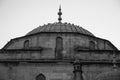 Historic mosque and pigeons photographed monochrome and high contrast MÃÂ±sri camii Afyon, Turkey