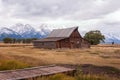 Historic Moulton Barn with snow-covered mountains in Moose, Wyoming Royalty Free Stock Photo