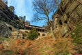 Historic mountain lodge surrounded by rocky cliffs and scenic nature Royalty Free Stock Photo