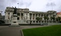 Statue of Richard John Seddon in front of old Edwardian parliament in grey stone with classic colonnade, Wellington, New Zealand Royalty Free Stock Photo