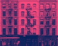 Historic old buildings in Tribeca, New York City with colorful pink and blue  background texture Royalty Free Stock Photo