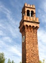 Historic old high Bell Tower with clock in Murano near Venice Royalty Free Stock Photo