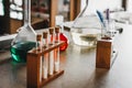 Historic old pharmacy bottles, laboratory beakers on a dark wooden table. Ancient medical laboratory Royalty Free Stock Photo