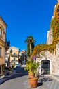 Historic old town with stone houses at Via Sesto Pompeo street aside Porta Catania gate of Taormina in Sicily in Italy Royalty Free Stock Photo