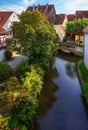 Historic old town of Noerdlingen at a small river Royalty Free Stock Photo