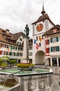 Historic old town of Willisau in canton Lucerne with city gate and fountain Royalty Free Stock Photo