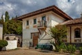 Historic Oriental-style Villa with a balcony and tiled roof with patio and garden Royalty Free Stock Photo