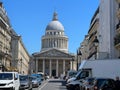 Historic Pantheon building with many cars parked nearby in Paris, France