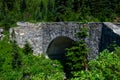 Historic Paradise River Bridge, stone bridge on Paradise Valley Road in Mt. Rainier National Park, WA on a beautiful summer day Royalty Free Stock Photo