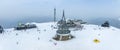 Aerial view of peace bell on snow covered landscape in kronplatz against sky