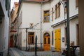 Historic picturesque renaissance house on the streets of old town, yellow wooden doors and window frames, paving stones, Christmas