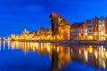 Historic port crane over Motlawa river in Gdansk at night