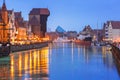 Historic port crane over Motlawa river in Gdansk at night