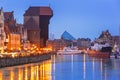 Historic port crane over Motlawa river in Gdansk at night Royalty Free Stock Photo