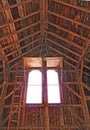 Historic 1891 post and beam wood timberframe barn interior gable end hay window Royalty Free Stock Photo