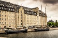 Historic sailing yachts on the water in front of an old building.  Copenhagen, Denmark - 17/07/2020 editorial Royalty Free Stock Photo