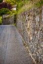historic protection wall of castle next to path Royalty Free Stock Photo