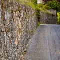 Historic protection wall of castle and road Royalty Free Stock Photo