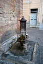 Historic pump on the square of an ancient town