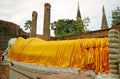 Historic Reclining Buddha Image in the Temple Ruins with the Stupas in Backdrop, Wat Yai Chai Mongkhon Temple, Ayutthaya, Thailand Royalty Free Stock Photo