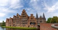 Historic red brick buildings and the Holstentor city gate in Luebeck