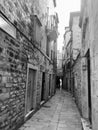 Historic residential buildings in a quiet back street in the city of Split in Croatia. Narrow street in Split. Black and White. Royalty Free Stock Photo