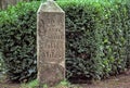 Historic road distance marker made of carved sandstone, indicating the distance in miles