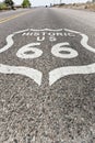 Historic Route 66 sign painted on asphalt of highway in Arizona - California Royalty Free Stock Photo