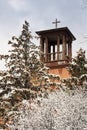 Historic Santa Fe Church Steeple Stands over snow